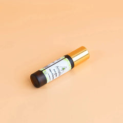 Amalia prickly pear anti-wrinkle Roll-on bottle with gold cap on a beige background