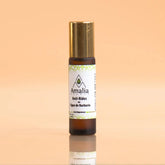 Amalia skincare serum bottle on a gradient background