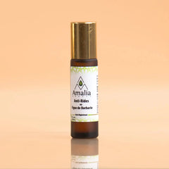 Amalia skincare serum bottle on a gradient background