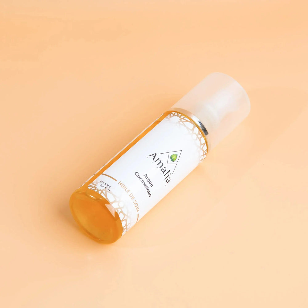 Amala skincare bottle on a beige background