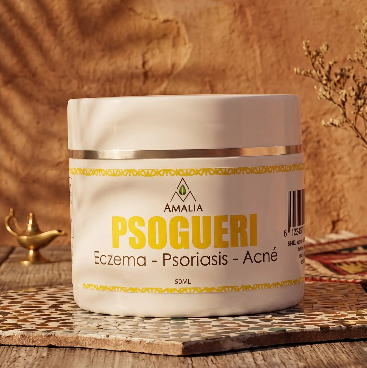 Jar of Psogueri cream on a wooden surface with a warm background