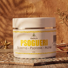 Jar of Psogueri cream on a wooden surface with a warm background