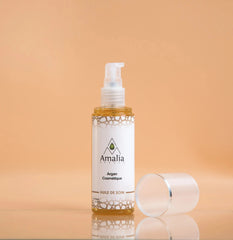 Amalia skincare product bottle with pump on a peach background