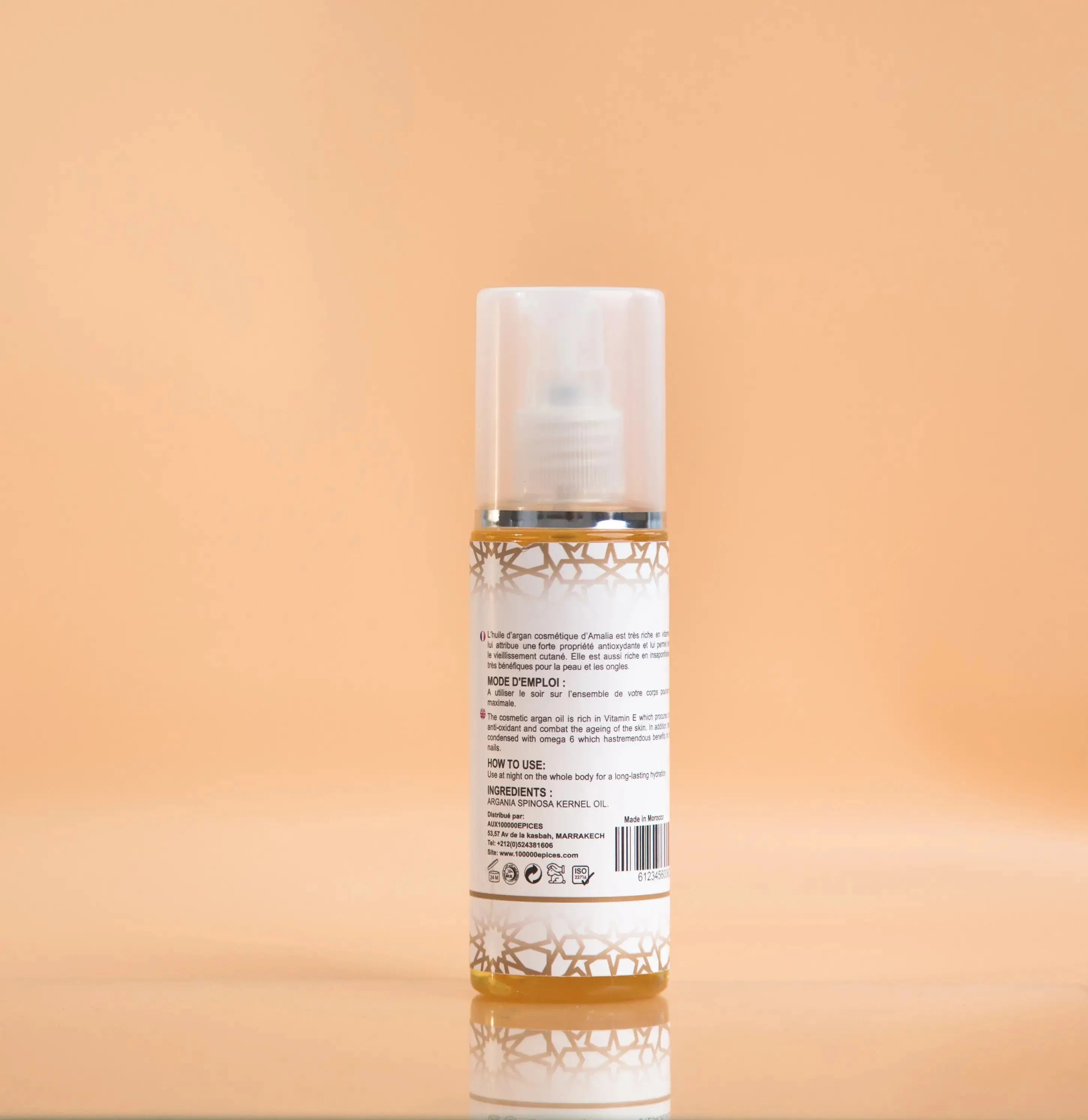 Skincare bottle with label on a peach background