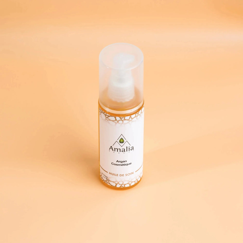 Amalia Argan Cleansing Oil bottle on a beige background